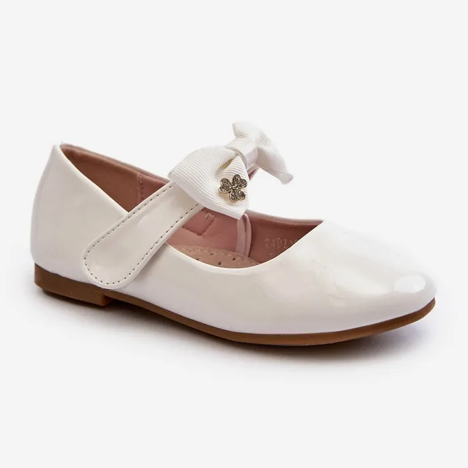 Children's patent white ballerina shoes with a Velcro bow